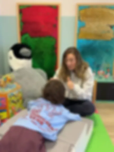 Practitioner and child in the sensory corner